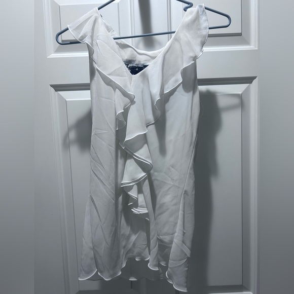 White formal top with ruffles on front and black lace back. - Picture 1 of 3